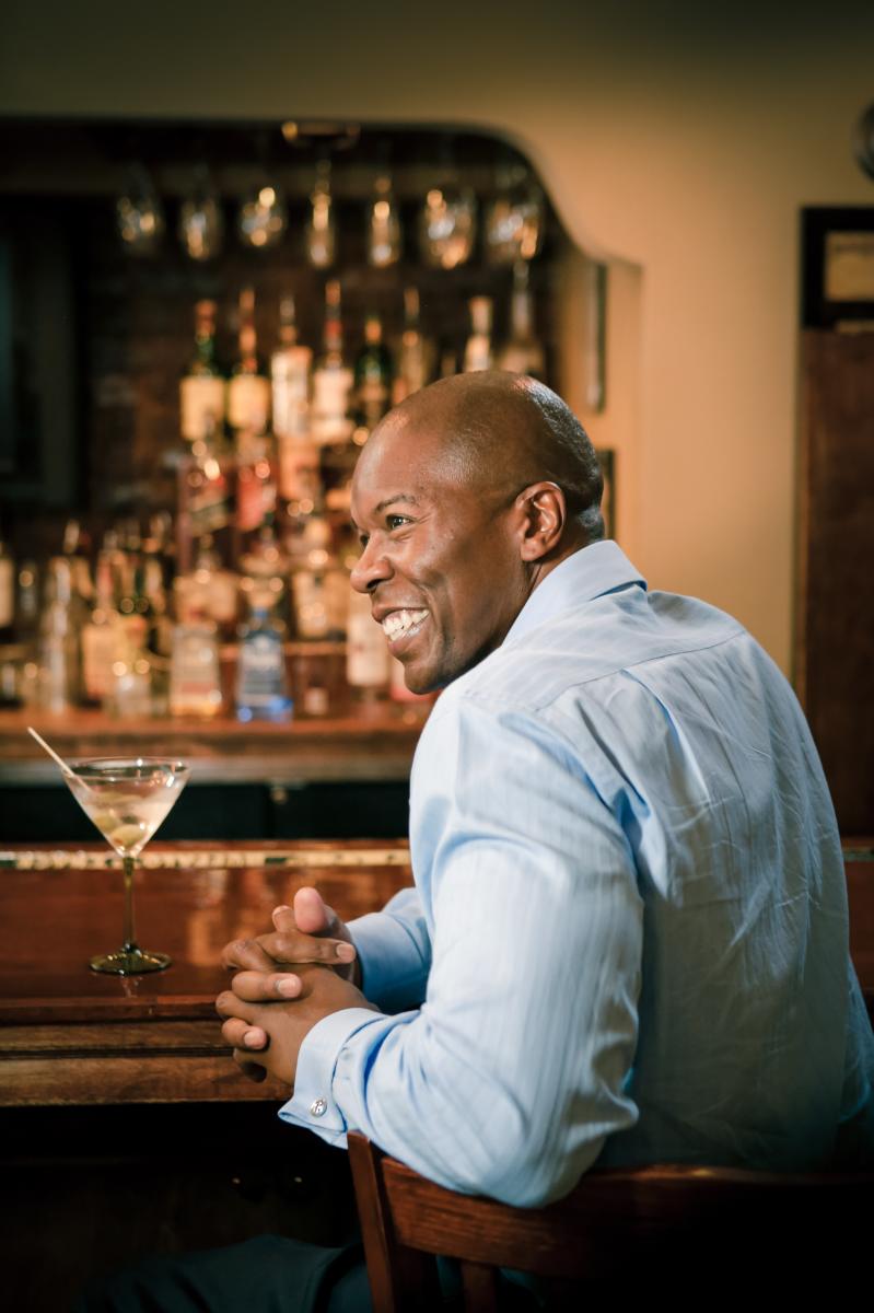 Man with a drink at the bar