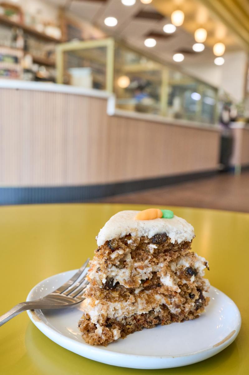 A piece of carrot cake is photograhed by Darrin Hackney at Bakesale Treat Parlor
