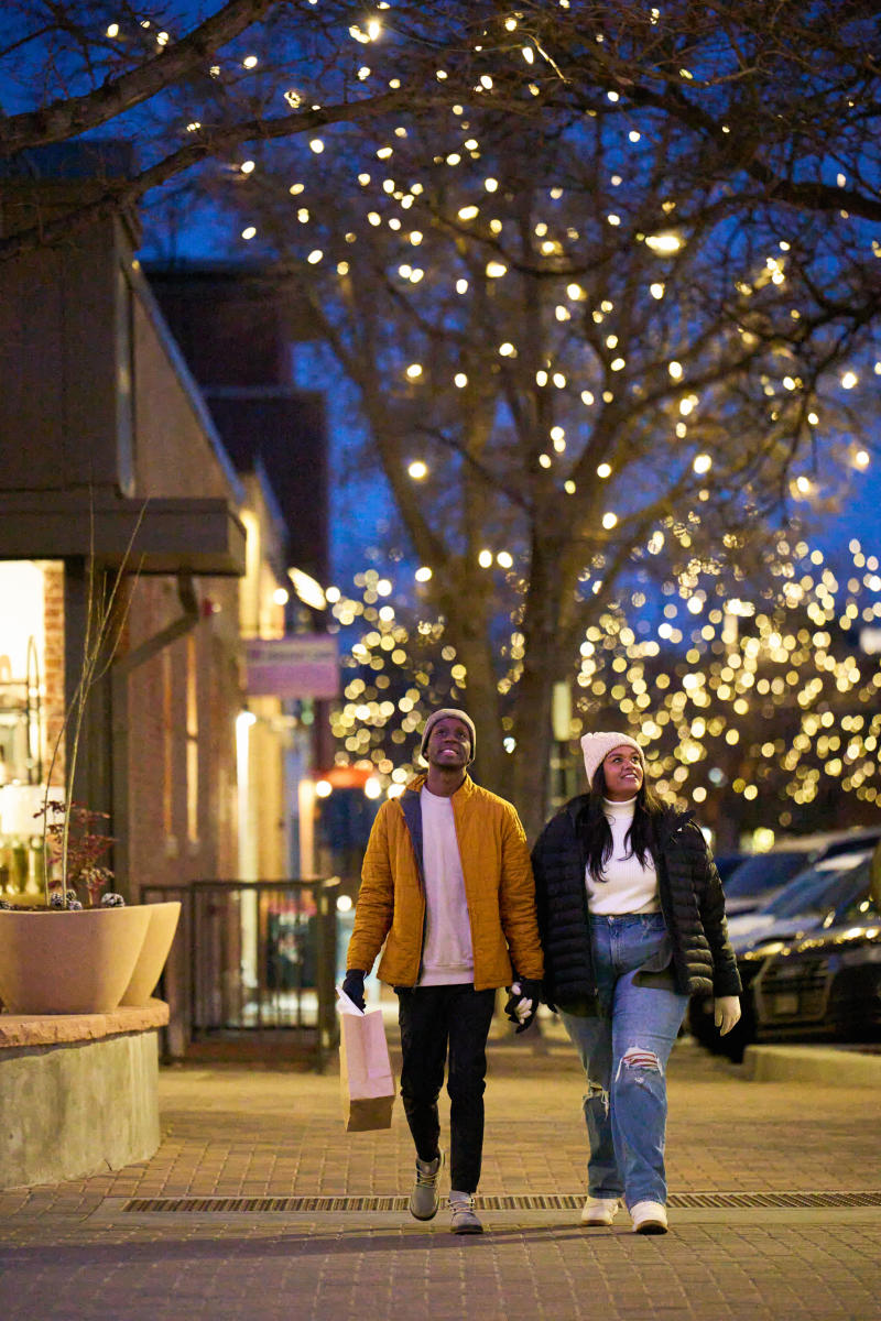 Couple walking and shopping through downtown in winter