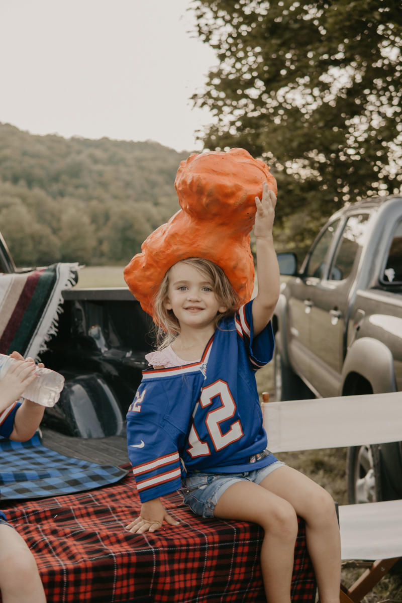 Girl with Chicken Wing Hat at Tailgate