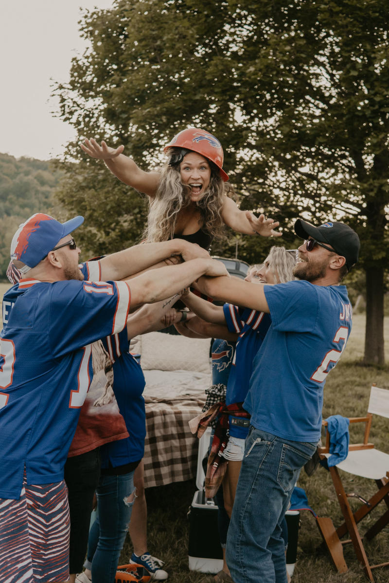 Woman Jumping at Tailgate