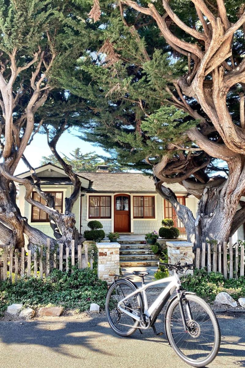 Electric bicycle parked in front of a beautiful home in Carmel.