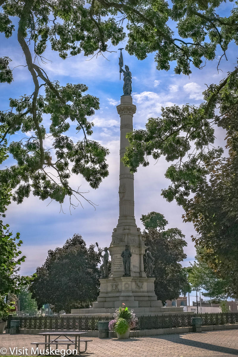 Soldiers and Sailors monument in Hackley Park surrounded by trees