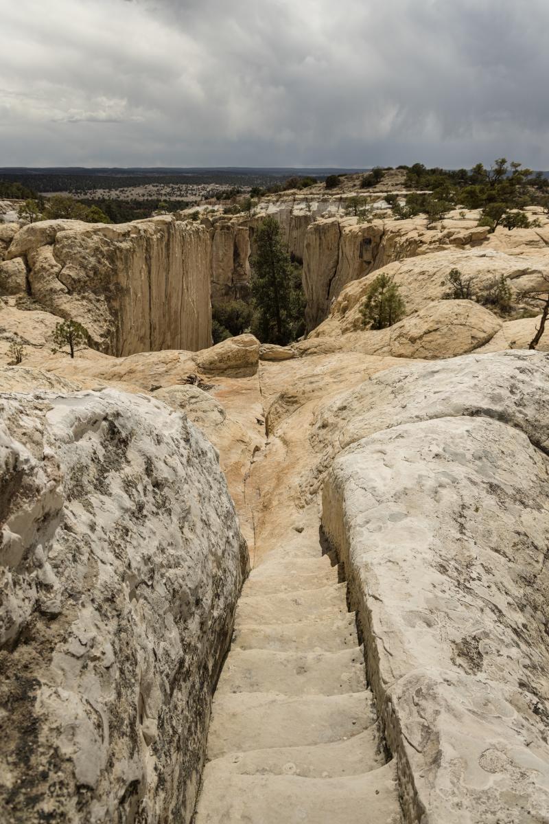 Ancient steps carved into the rock lead to pueblo ruins at El Morro.