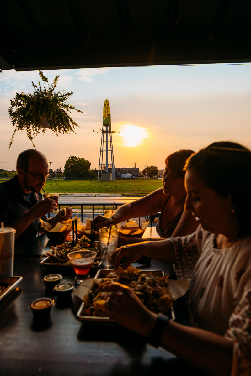 The Workshop Food Hall patio with Ear of Corn Water Tower in Background