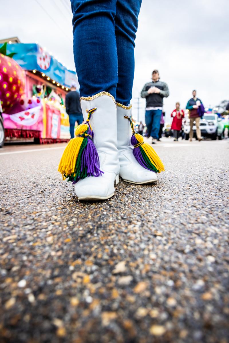 White boots and Mardi Gras colors for the Olympia Parade in Covington