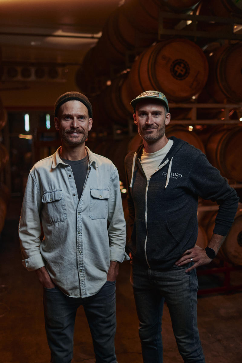 Max and Luke Udsen stand in their barrel room at Bethel Road Distillery and Winery in Paso Robles.