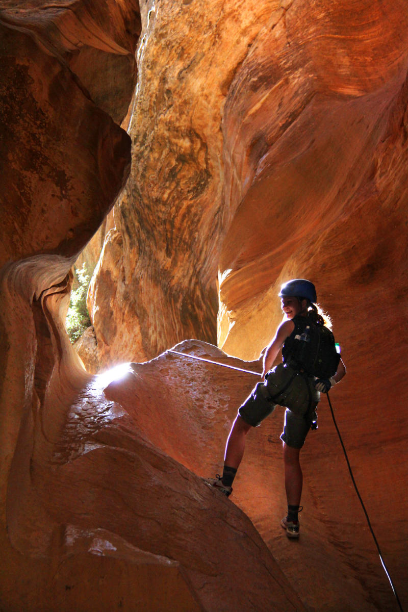 Woman Canyoneering in Slot Canyons in Zion National Park