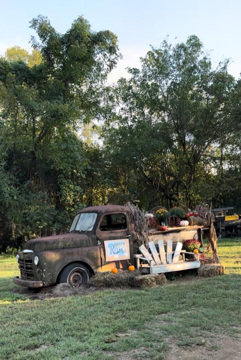 Old truck with fall decorations at Hidden Rivers Farm