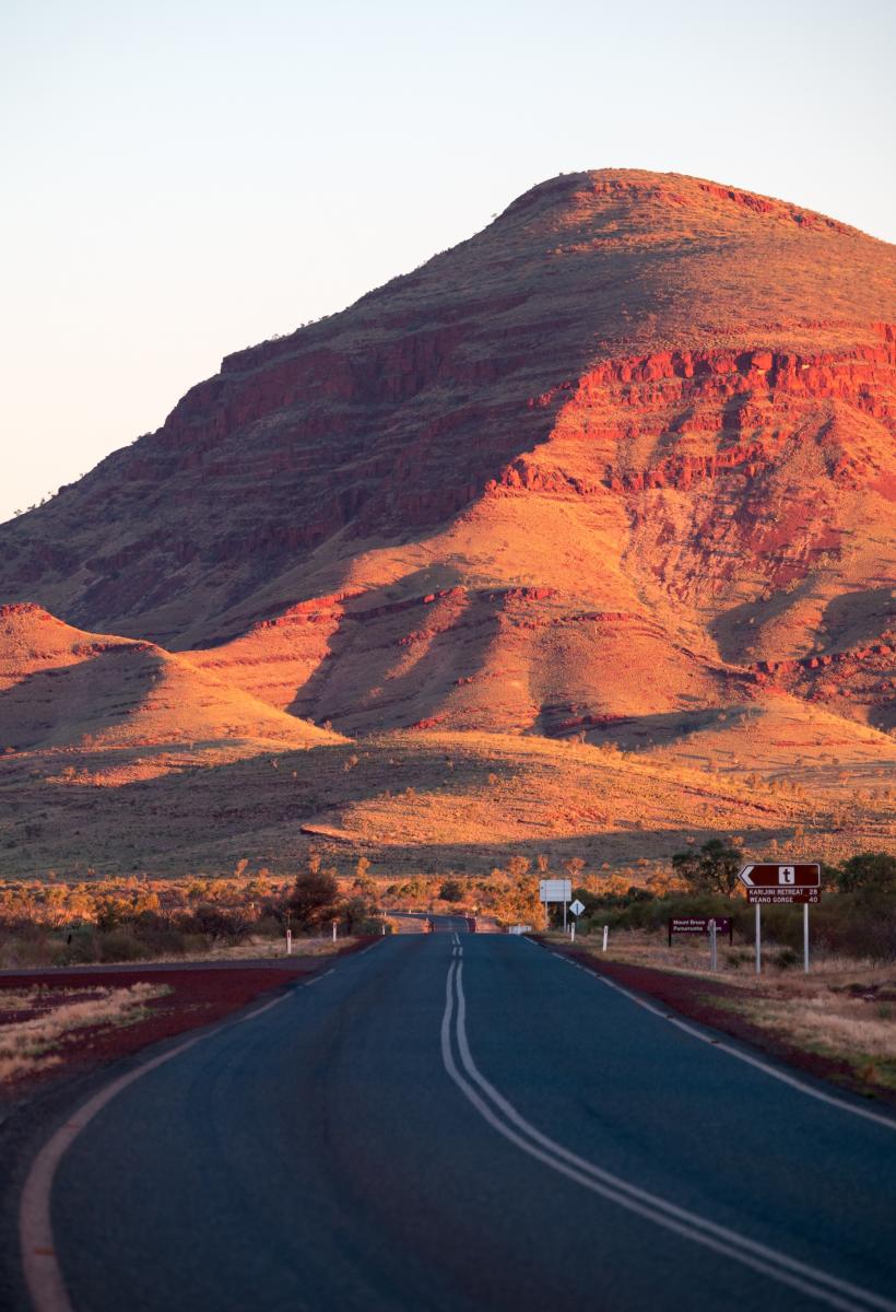Karijini Drive, with signposts to Weano Gorge, Karijini Eco Retreat and Mt Bruce