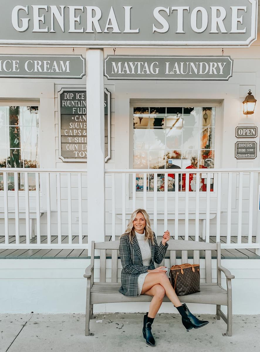 The Coastal Blonde poses for a picture in front of Beaufort's beloved General Store.