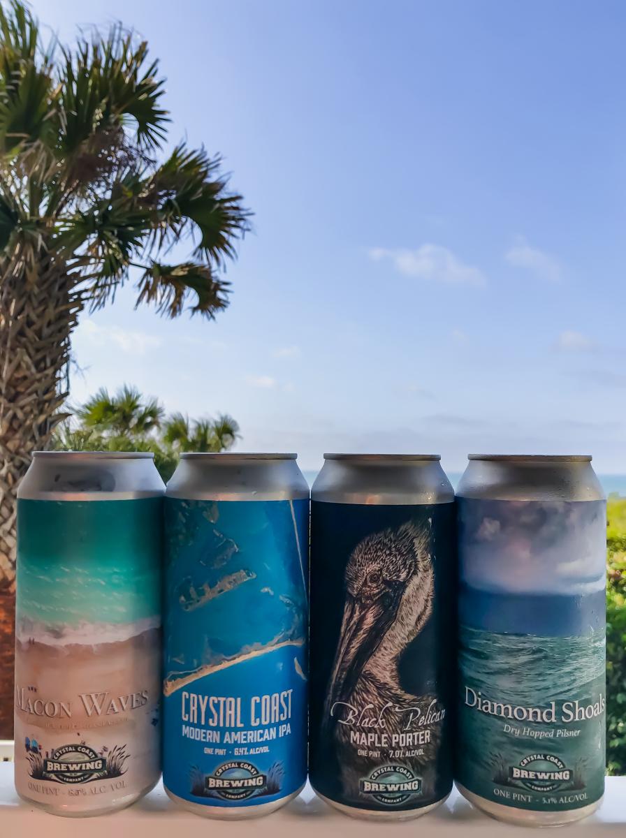 Assorted cans of beer from Crystal Coast Brewing Company