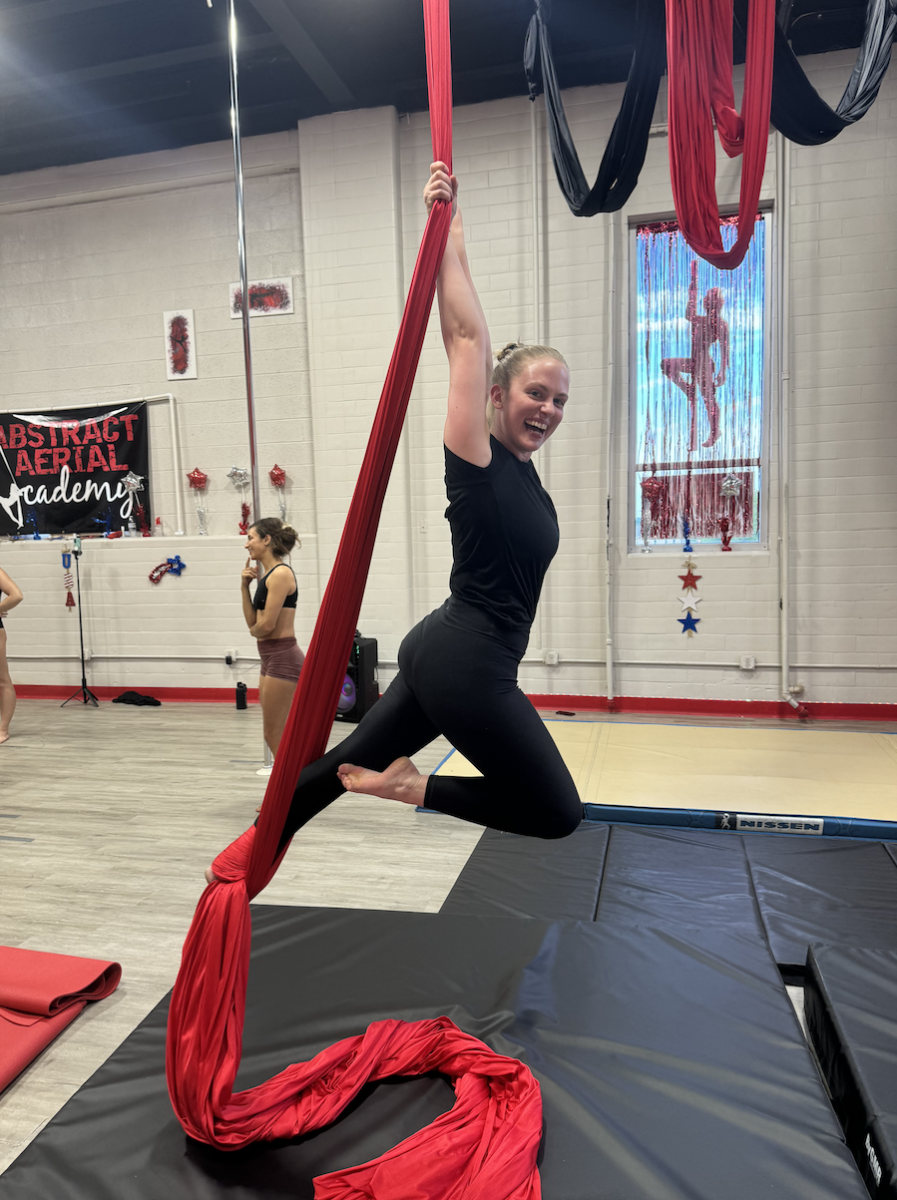Student hanging from aerial silks at Abstract Aerial Academy in Allentown, PA