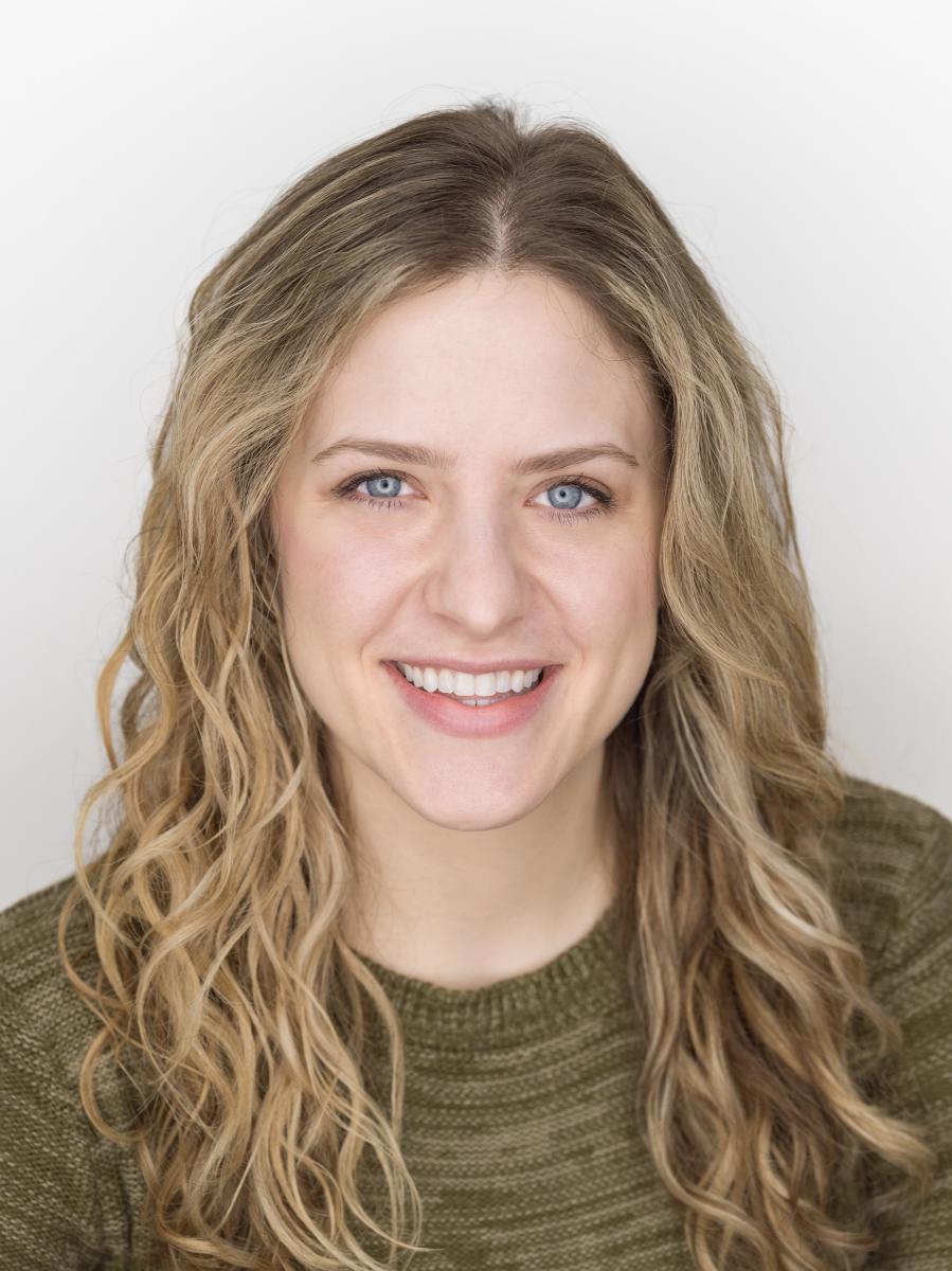 Close up headshot of Megan Vruwink to announce the new Director of Marketing