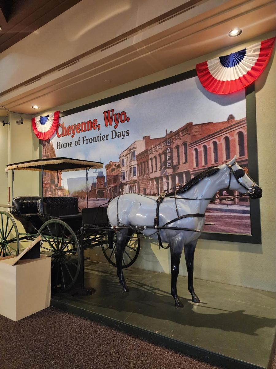 Horse-drawn carriage exhibit at the Cheyenne Frontier Days Old West Museum, a fun indoor attraction for history lovers.