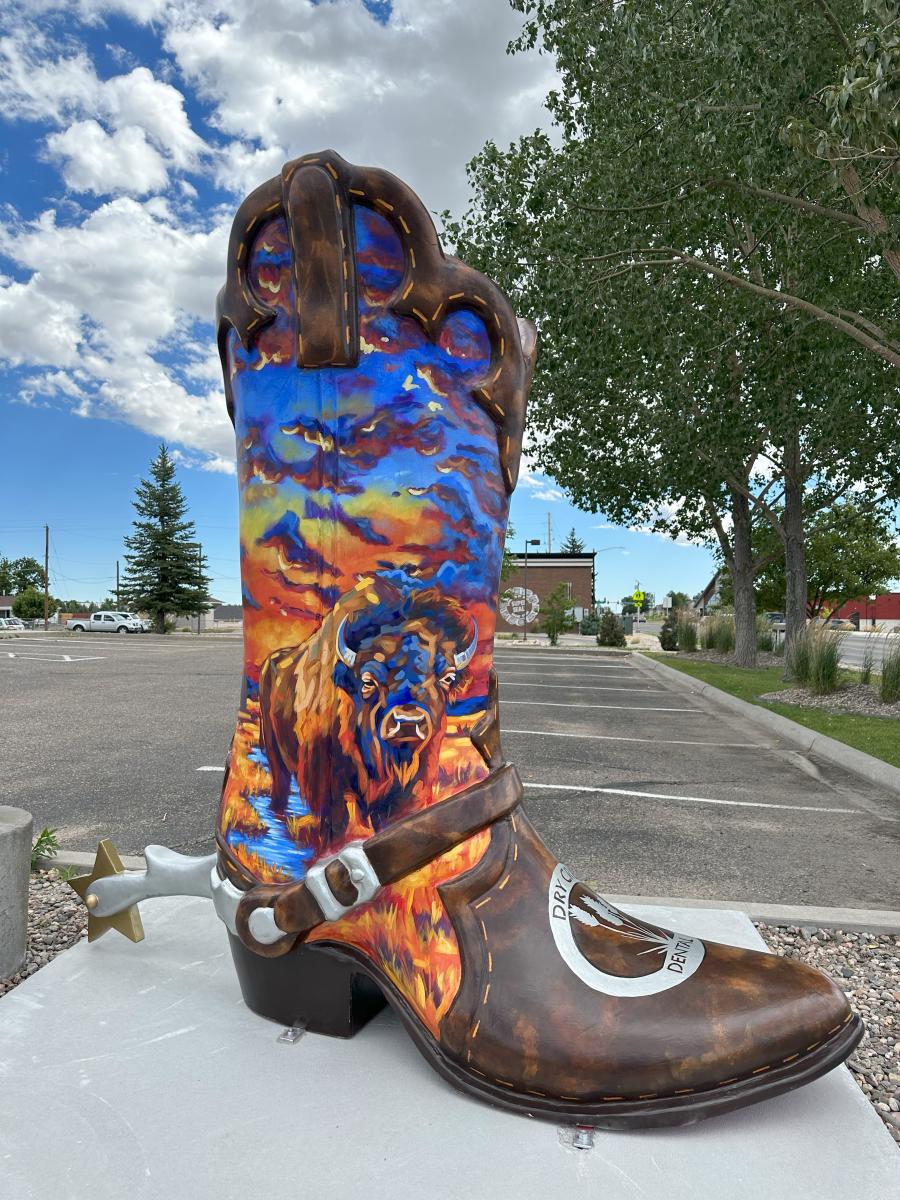 8' Boot with bison painted in front of dark blue sky