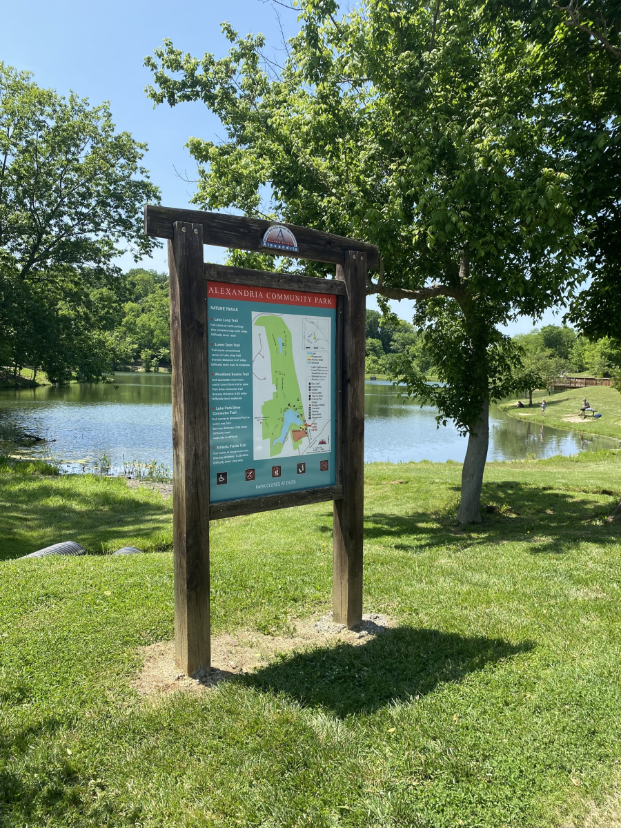 Information board next to the lake on a bright summer day at Alexandria Community Park
