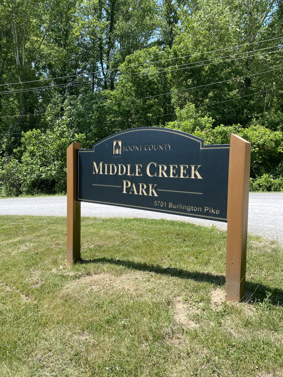 Image is of the sign at the entrance of the park that says "Middle Creek Park, 5701 Burlington Pike".