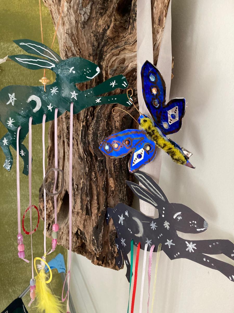 An Easter themed mobile with rabbits and butterfly