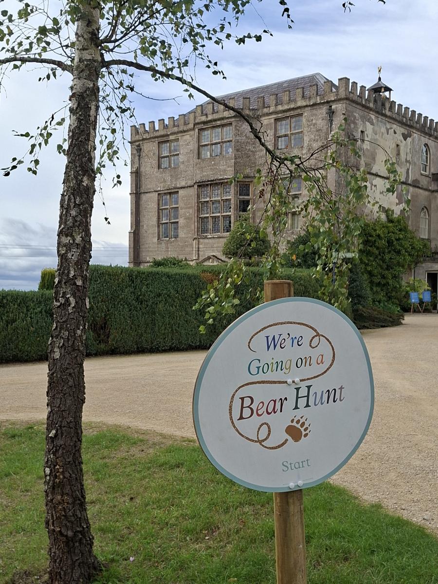 Sign reading “We’re Going on a Bear Hunt” in the grounds of the historic house at Newark Park in the Cotswolds