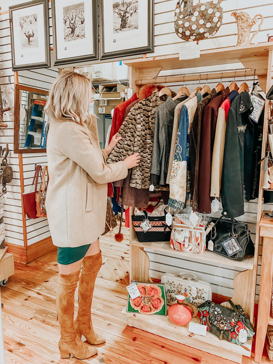 The Coastal Blonde looks through the racks on a shopping trip to Beaufort Mercantile Company.