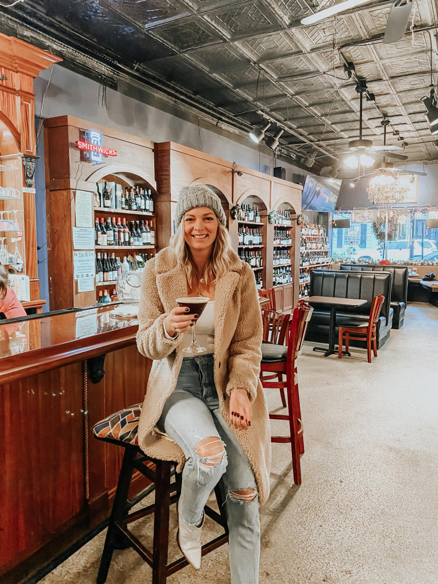 A visitor enjoys a drink at the Cru Bar in Beaufort, NC.