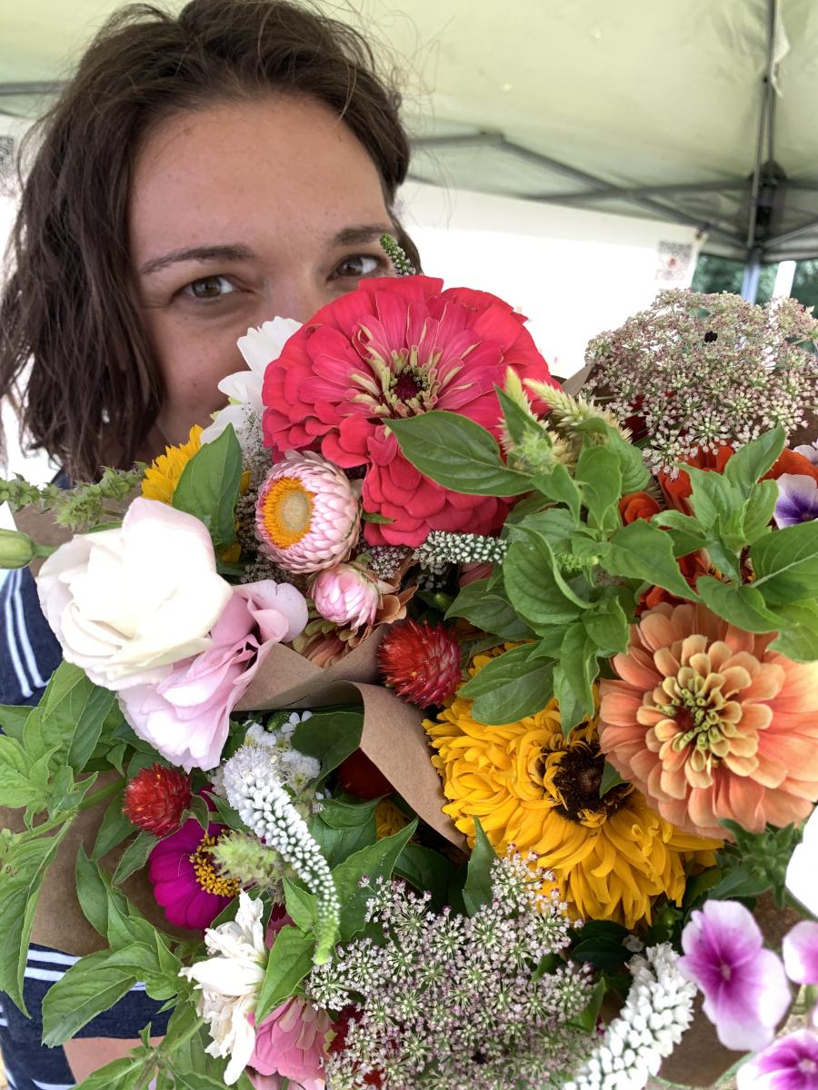 Woman With Flowers At The Farmers Market