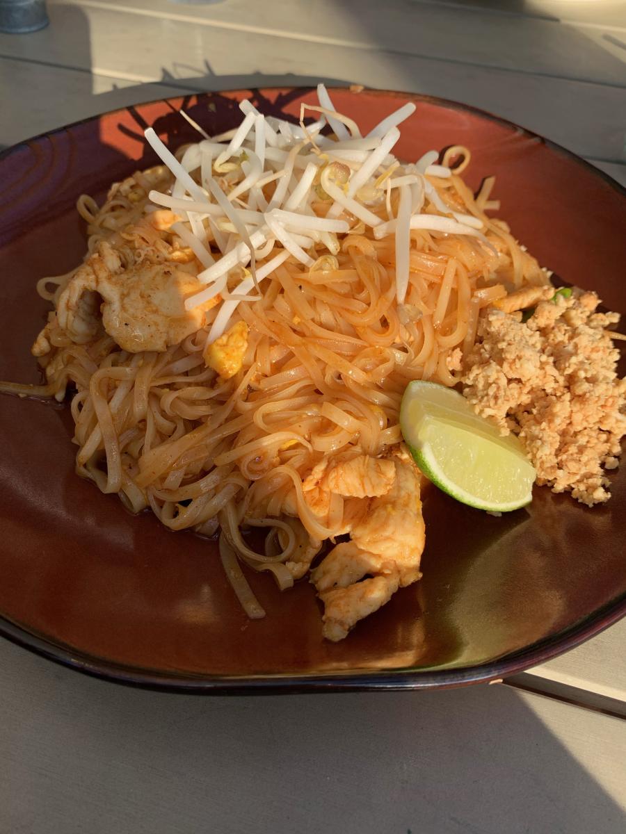 Nawa's Pad Thai noodles with lemon and bean sprouts garnish