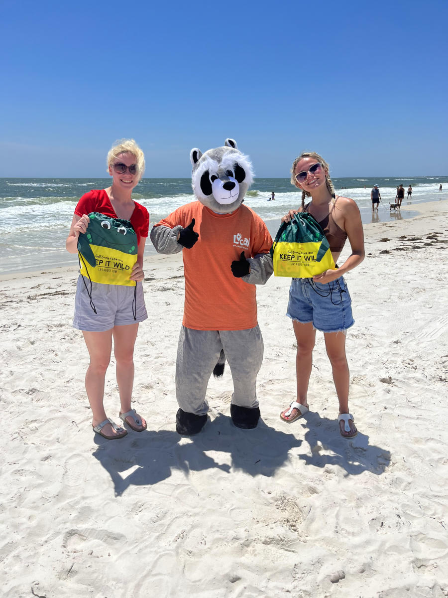 Ray the Responsible Raccoon poses with some "Wild Wins" Trivia Winners