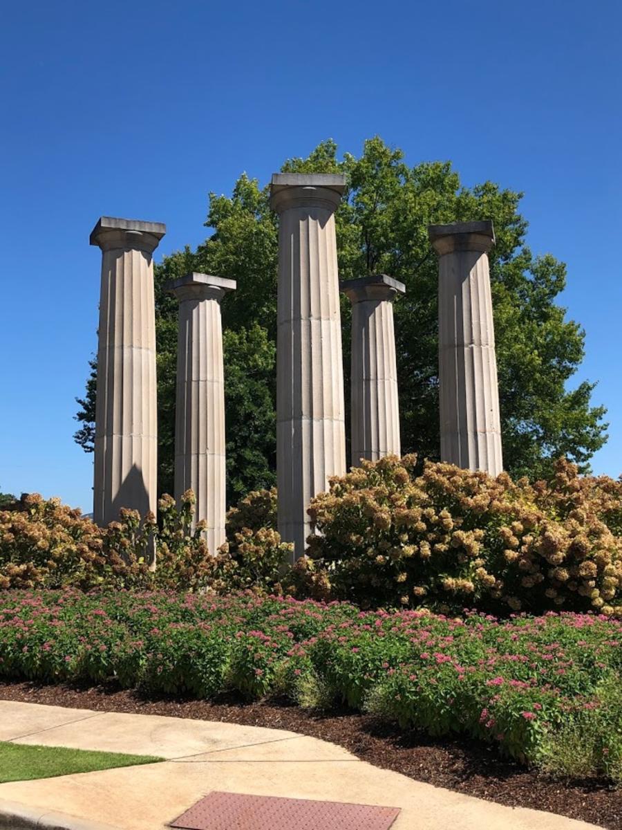 A few of the fluted limestone columns from the second courthouse can now be seen at the entrance to the Huntsville Botanical Garden.
