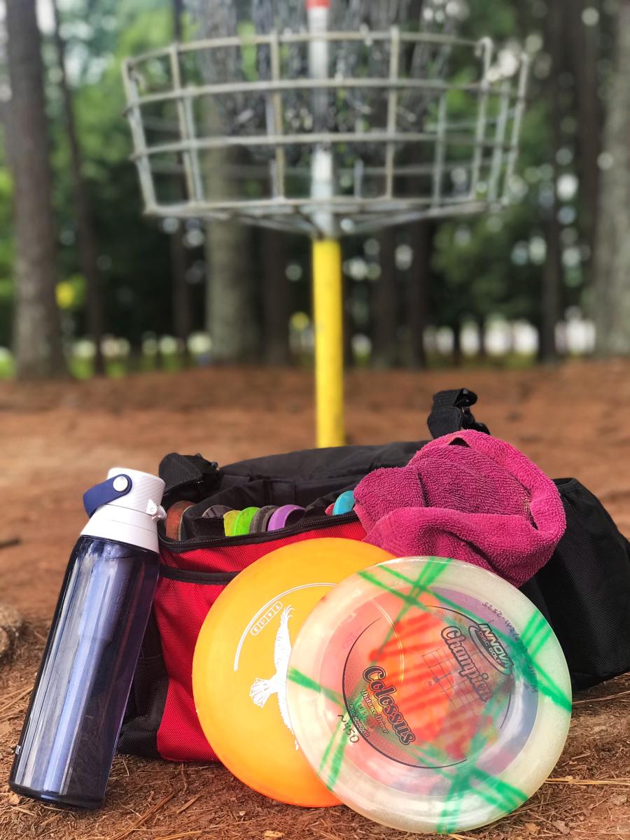 Disc Golf Gear and Hole Photo