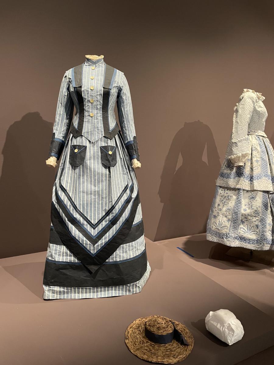Two paper dresses on display at the Wichita Art Museum