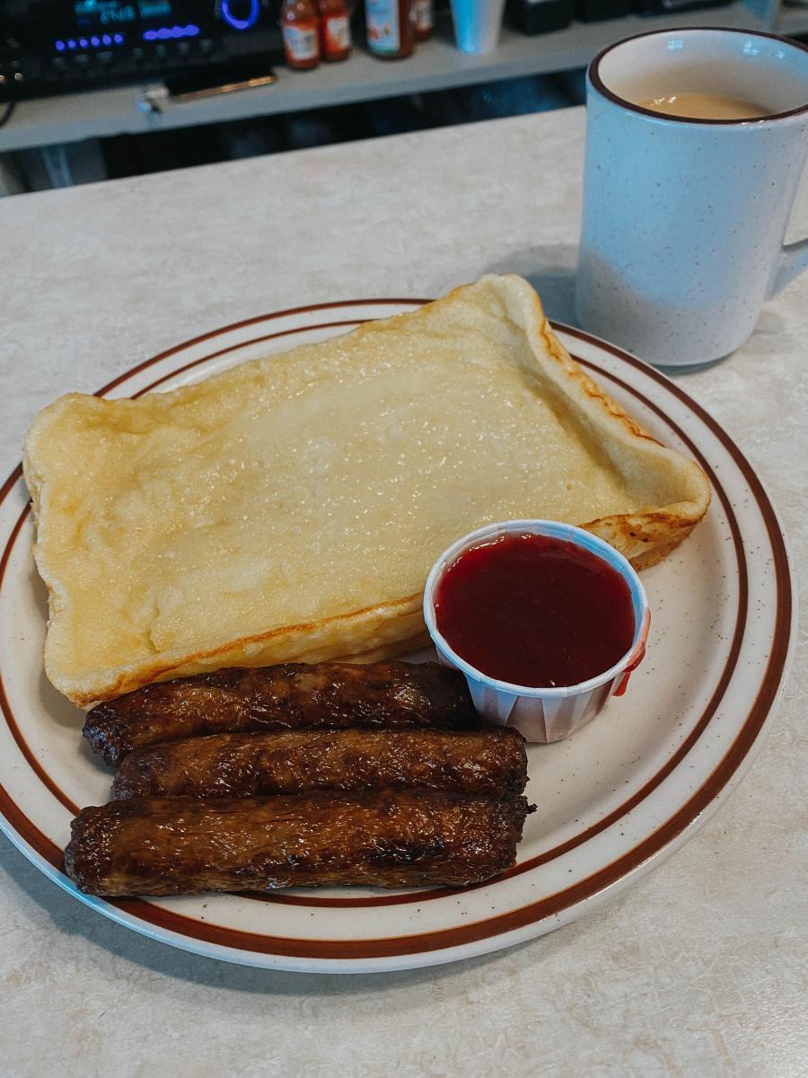 a plate of traditional finnish pannukakku, a square custardy pancake