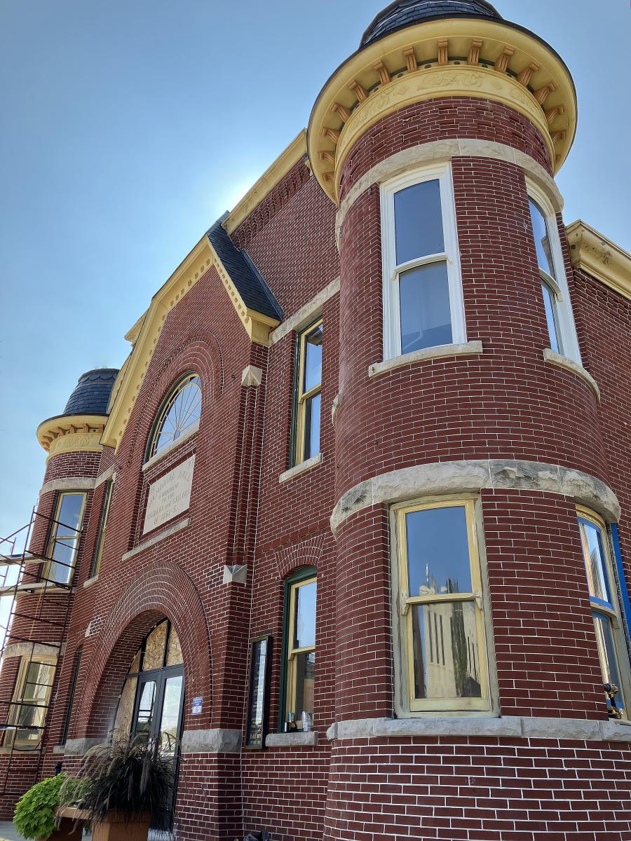 A red brick building with decorative elements.
