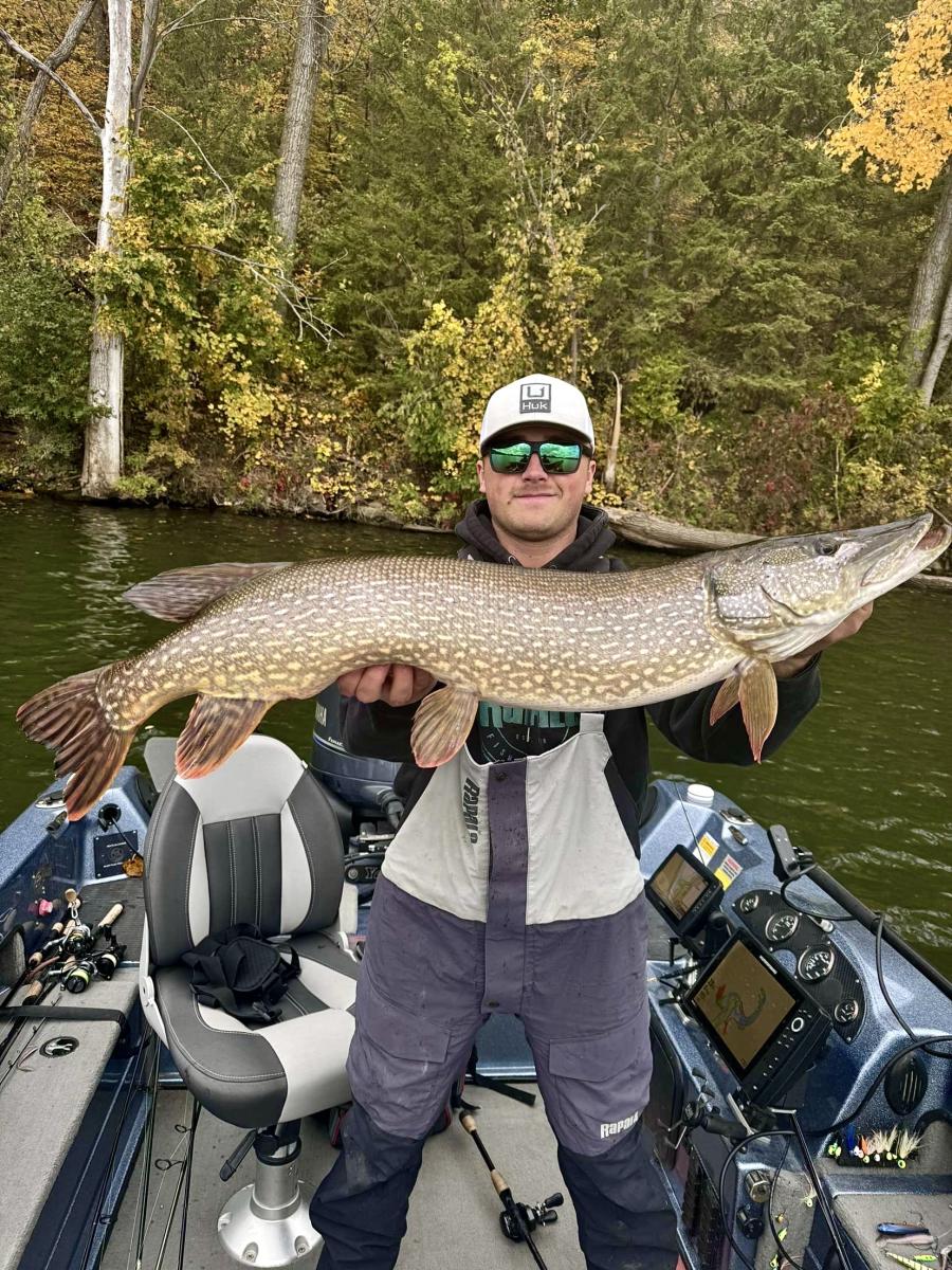 Man catches a northern pike on Lake Zumbro