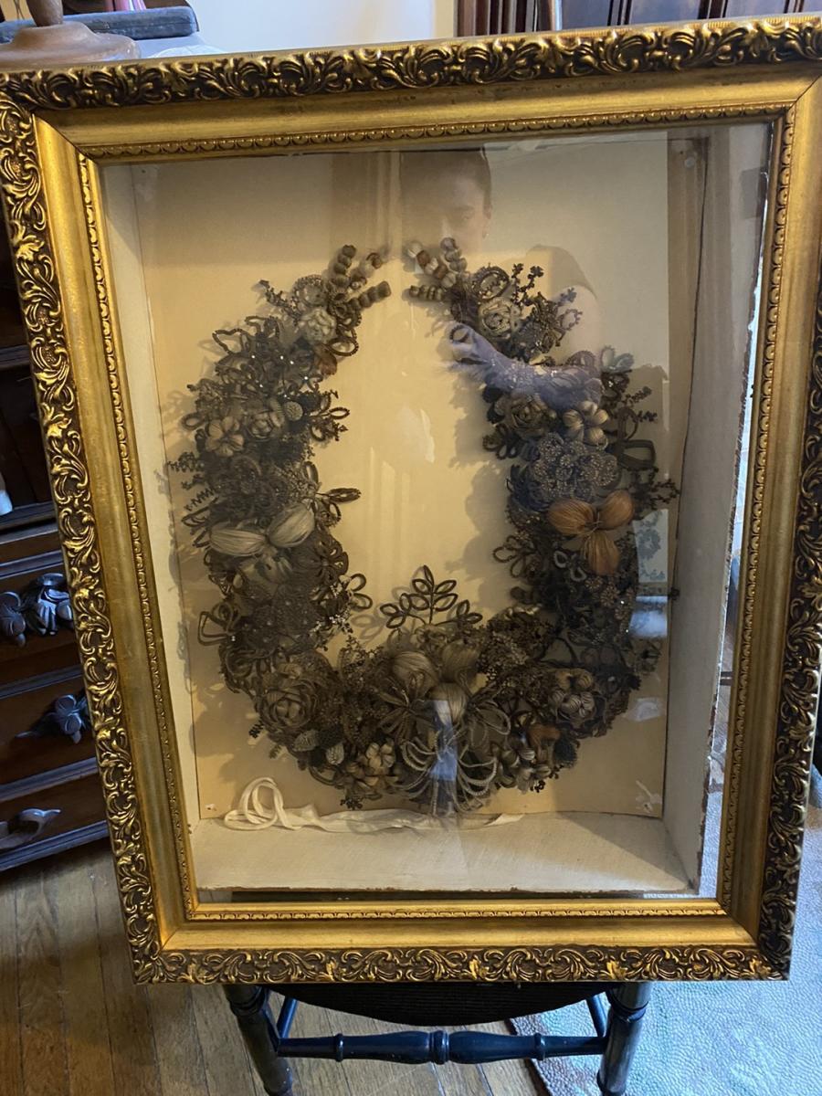 wreath made of hair in a glass framed case