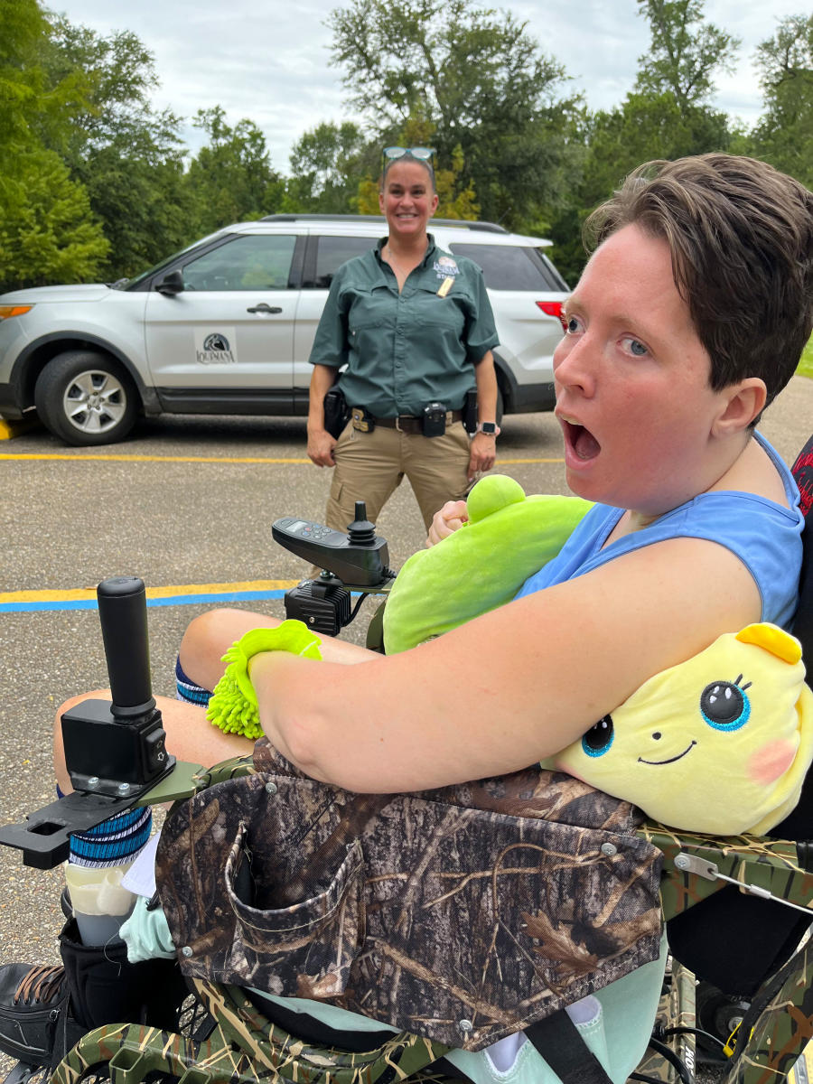 PJ Paulsell sits in an all-terrain TrackChair with Fontainebleau State Park General Manager Jennifer Wallace before exploring the park's accessible trails.
