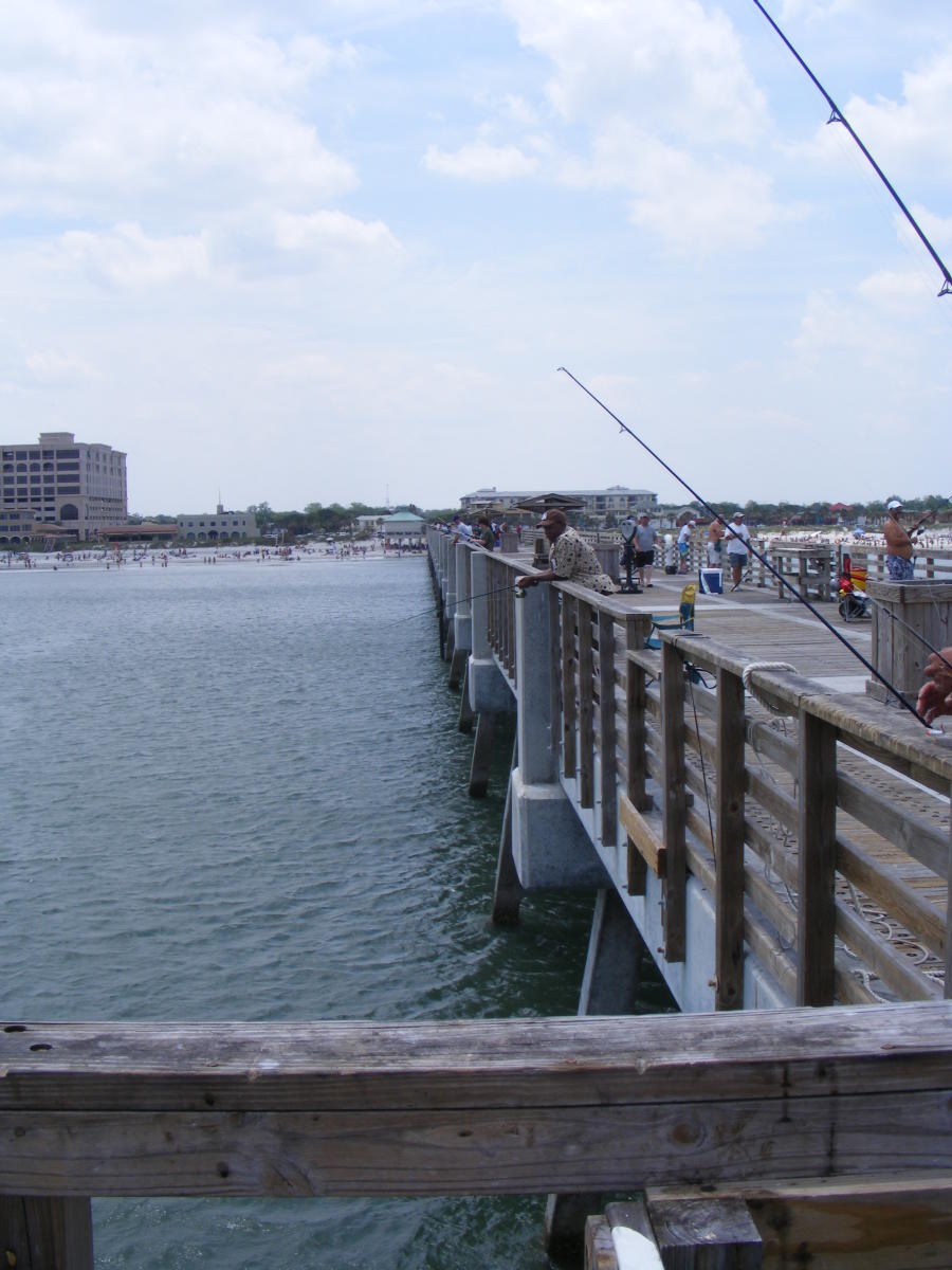 People fishing off the Jacksonville Beach pier