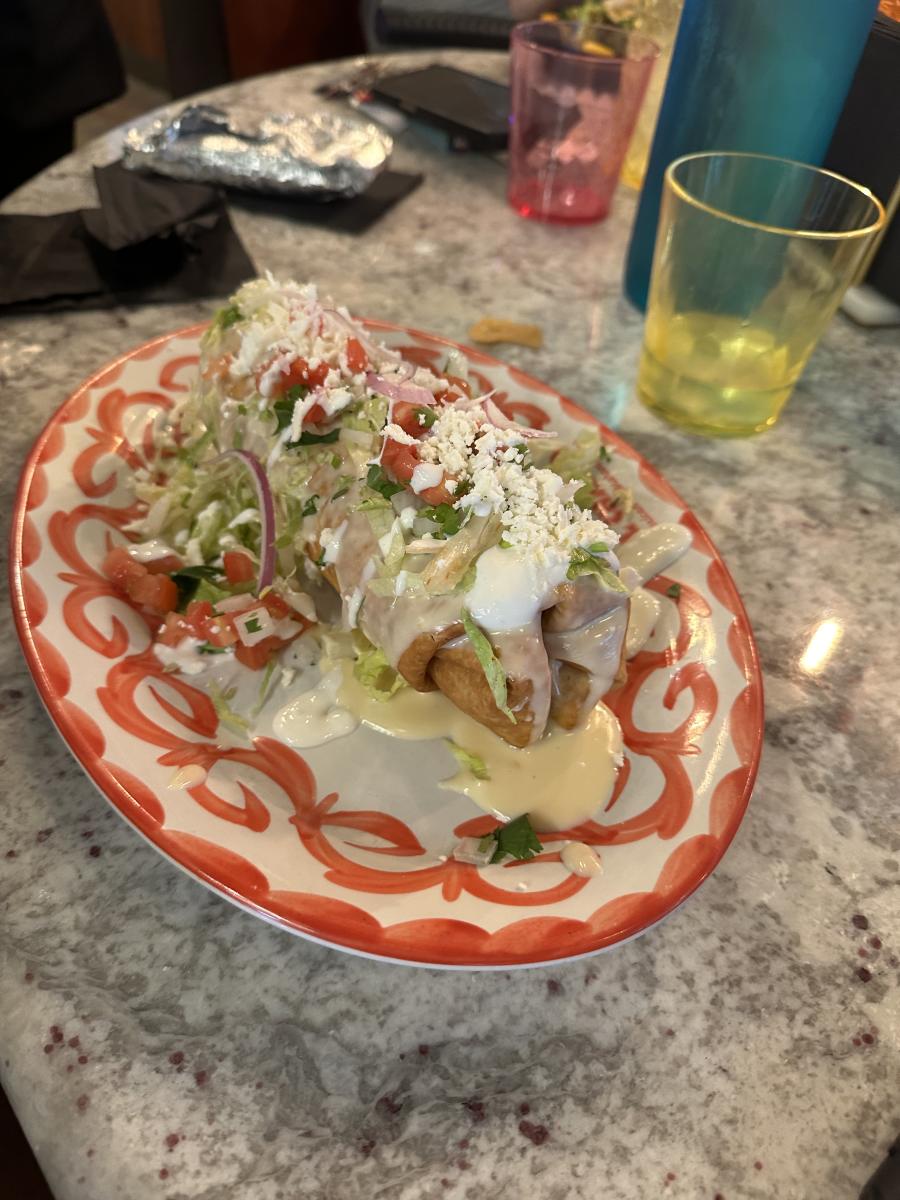 Taquitos with cheese sauce