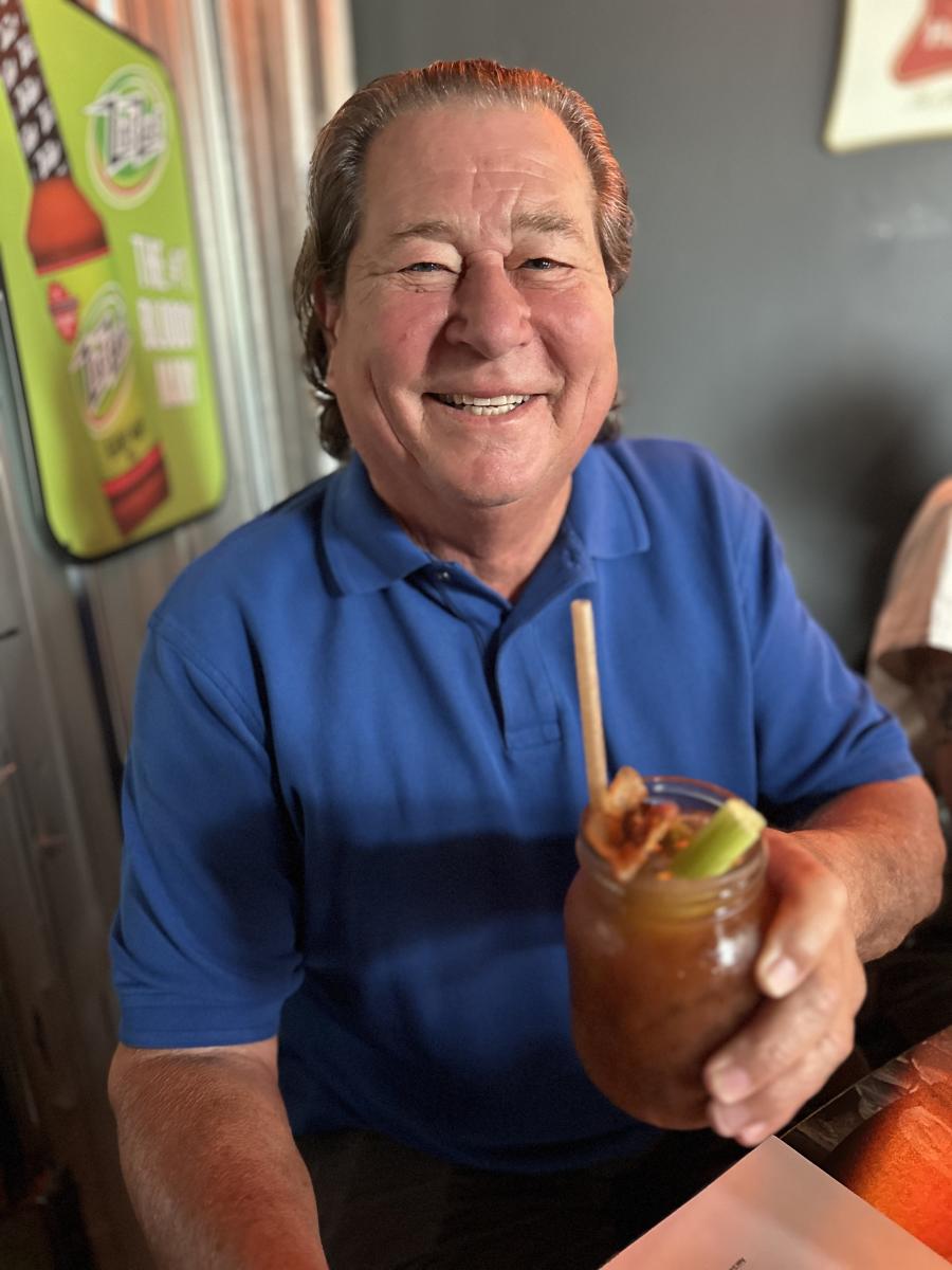 Man Holding Drink at Sixth Street Dive