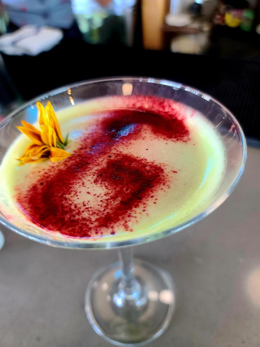 A martini features a colorful "G" sprinkled on top at GROW