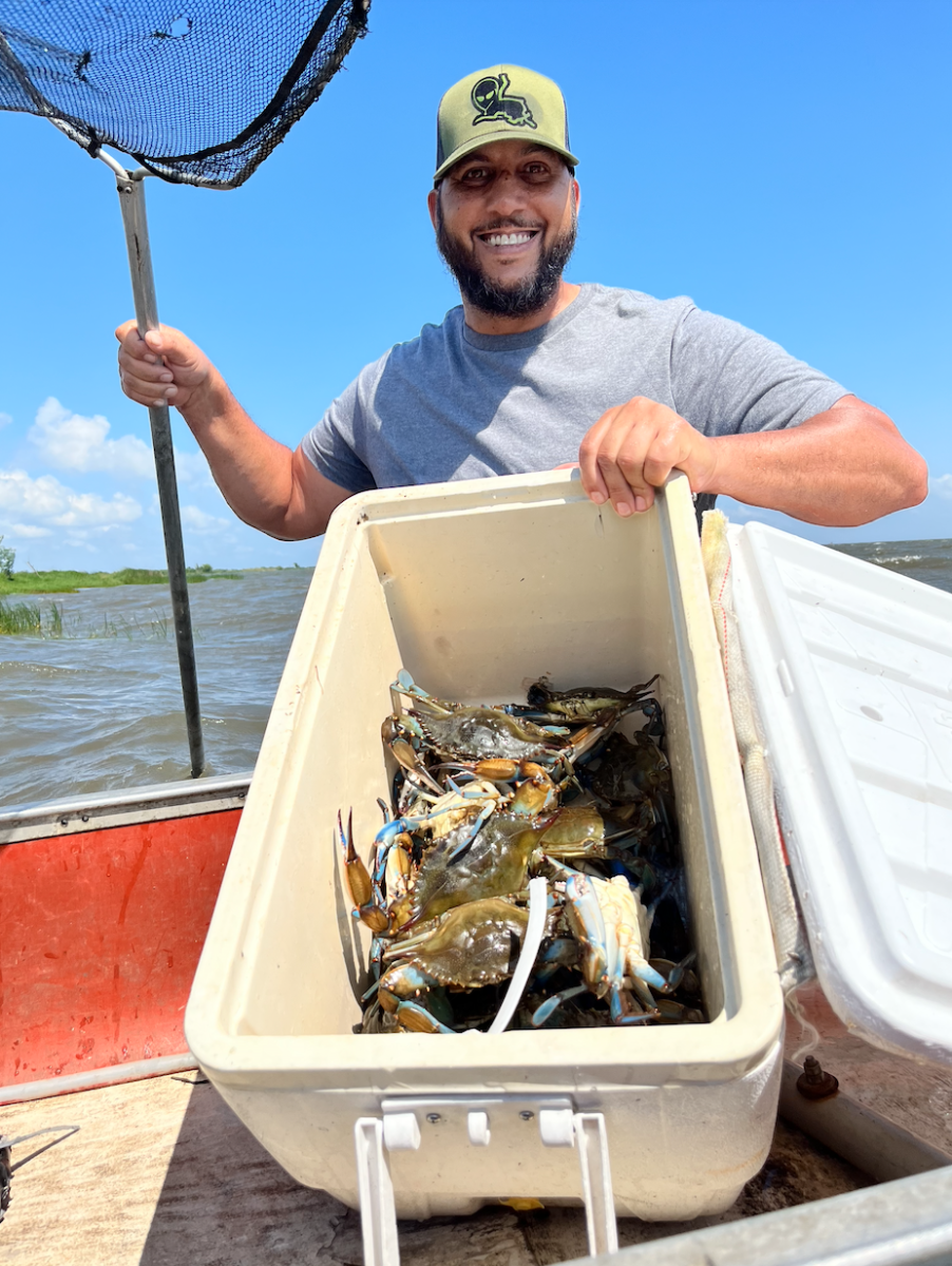 Fisherman Corey LaBostrie of Lacombe loads his ice chest with Louisiana Blue Crab from Lake Pontchartrain.