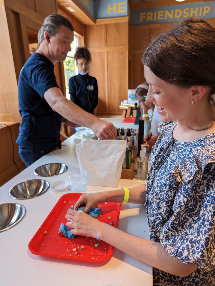 CAMP X Disney Woman making slime at counter