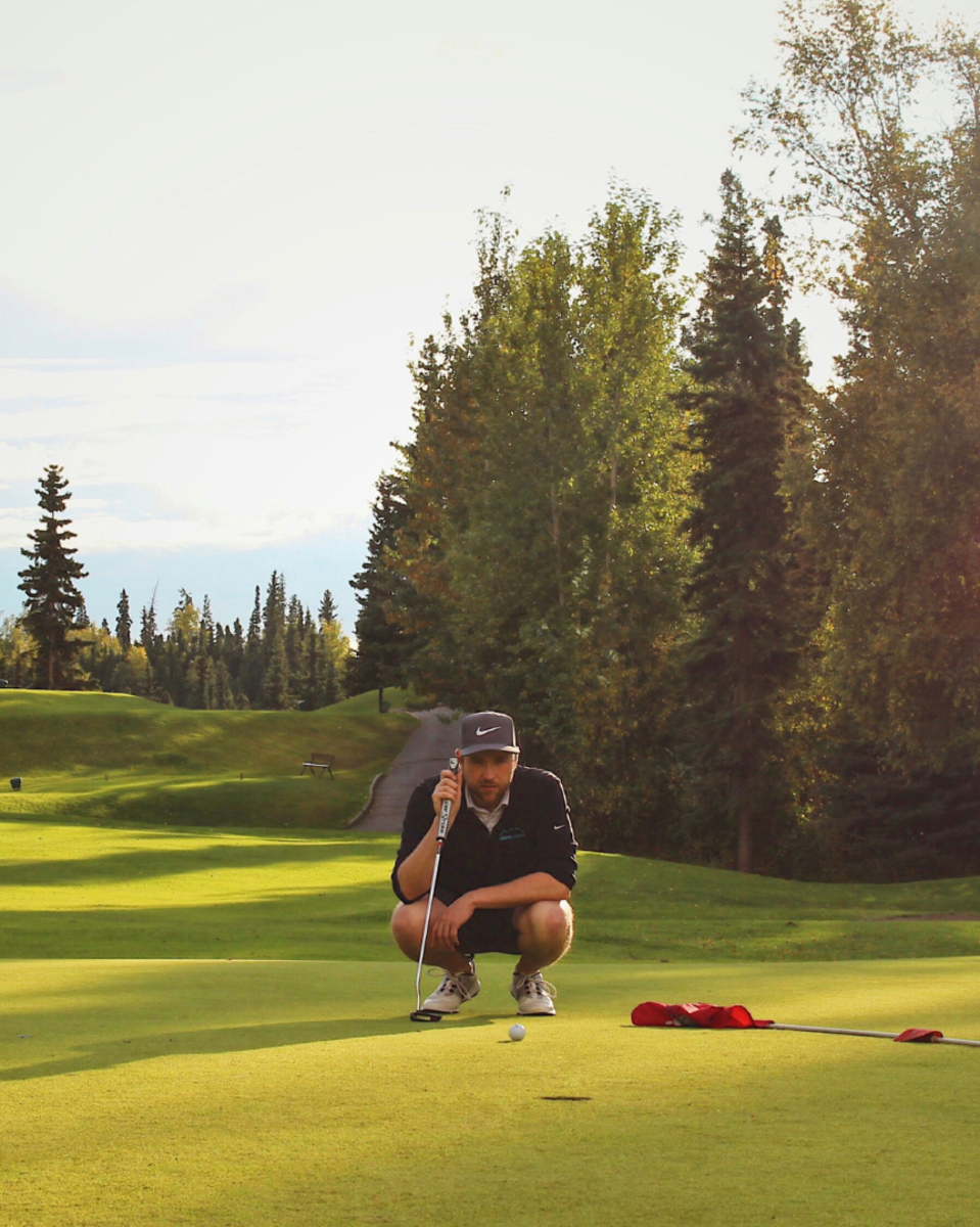 Golfer Putting at Anchorage Golf Course