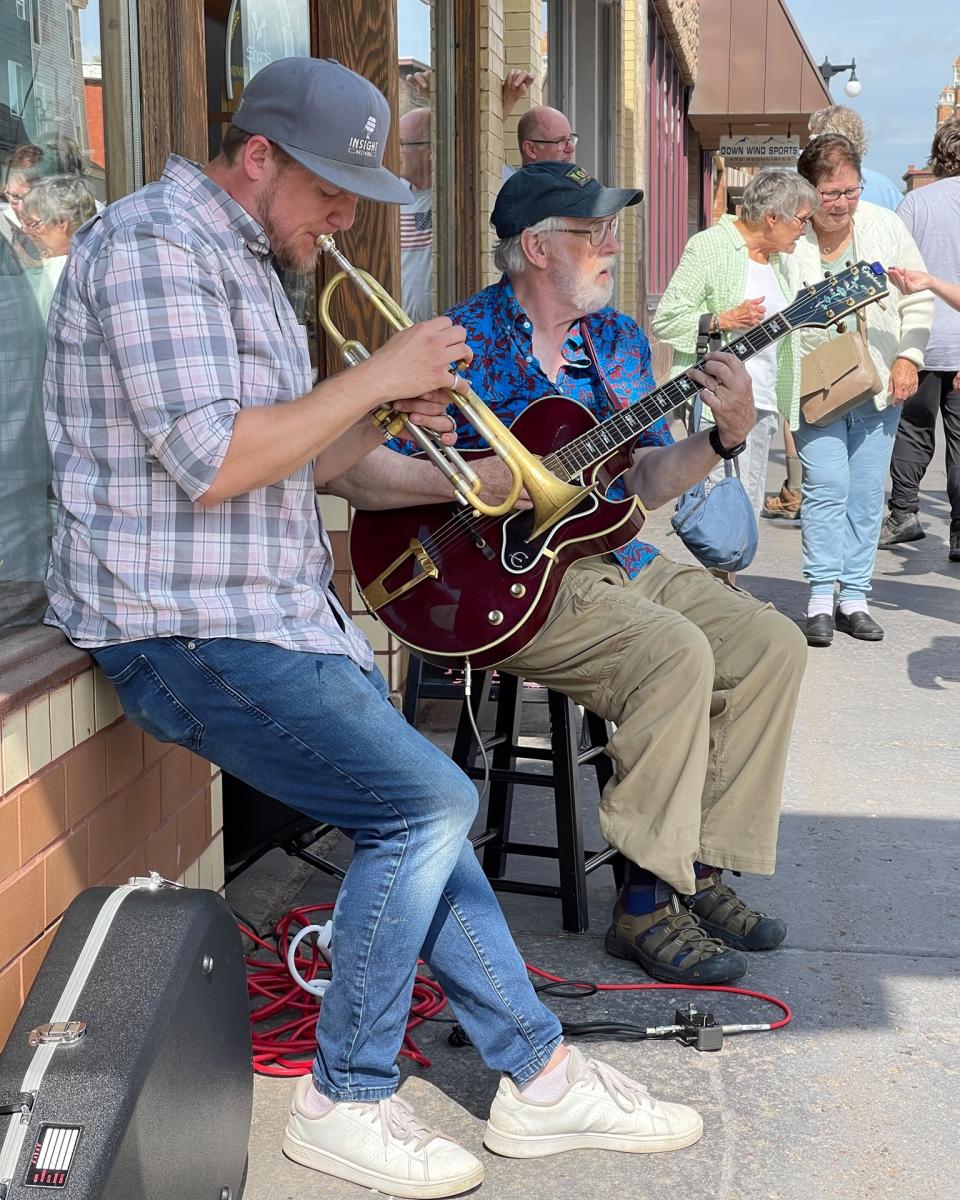Street musicians playing in downtown Houghton