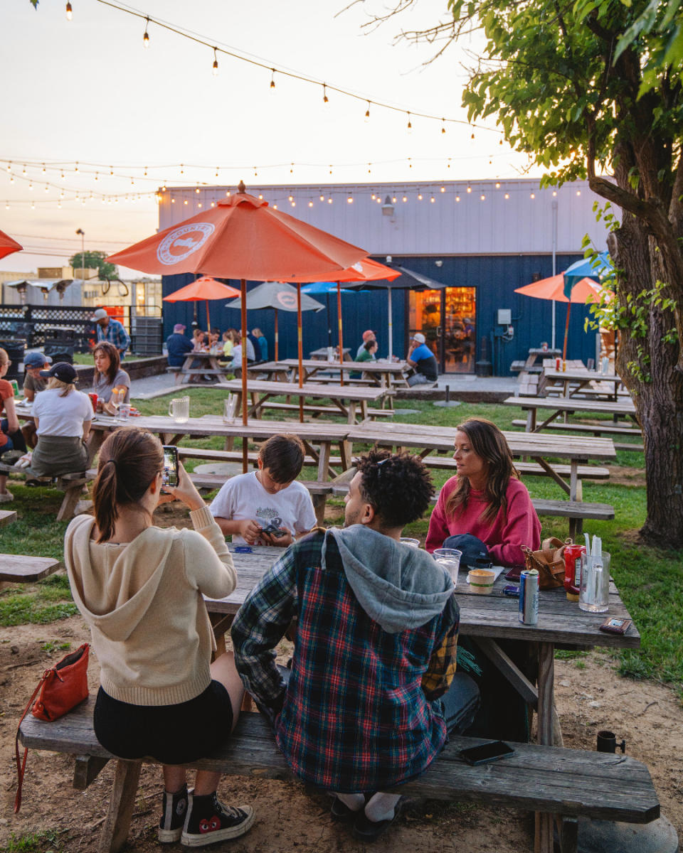People dining on a picnic table