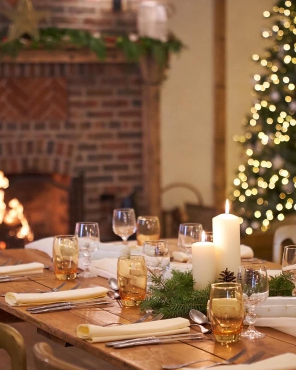 Christmas dining by the fireplace at Burley Manor in the New Forest