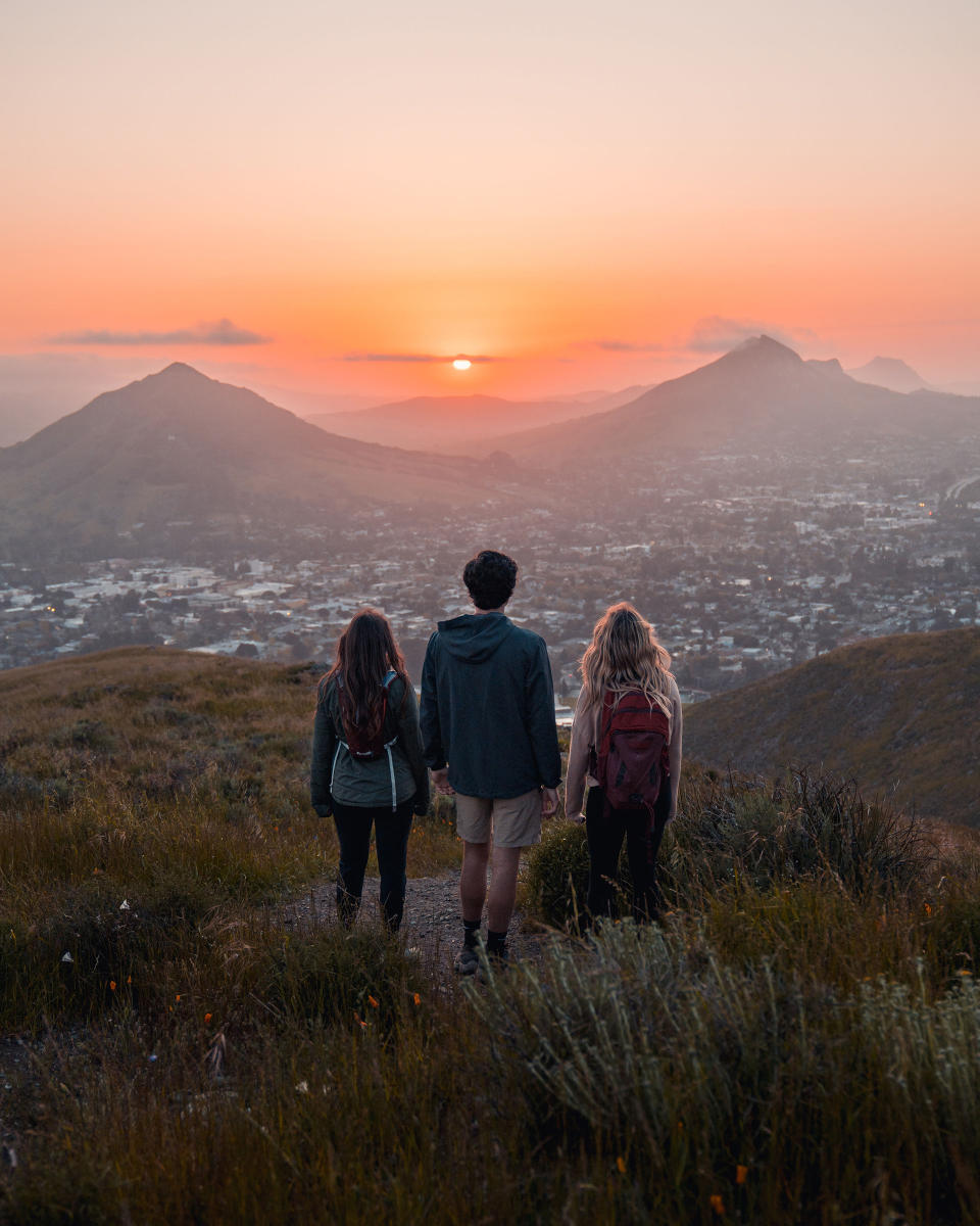friends enjoying a sunset while on a hike in San Luis Obispo