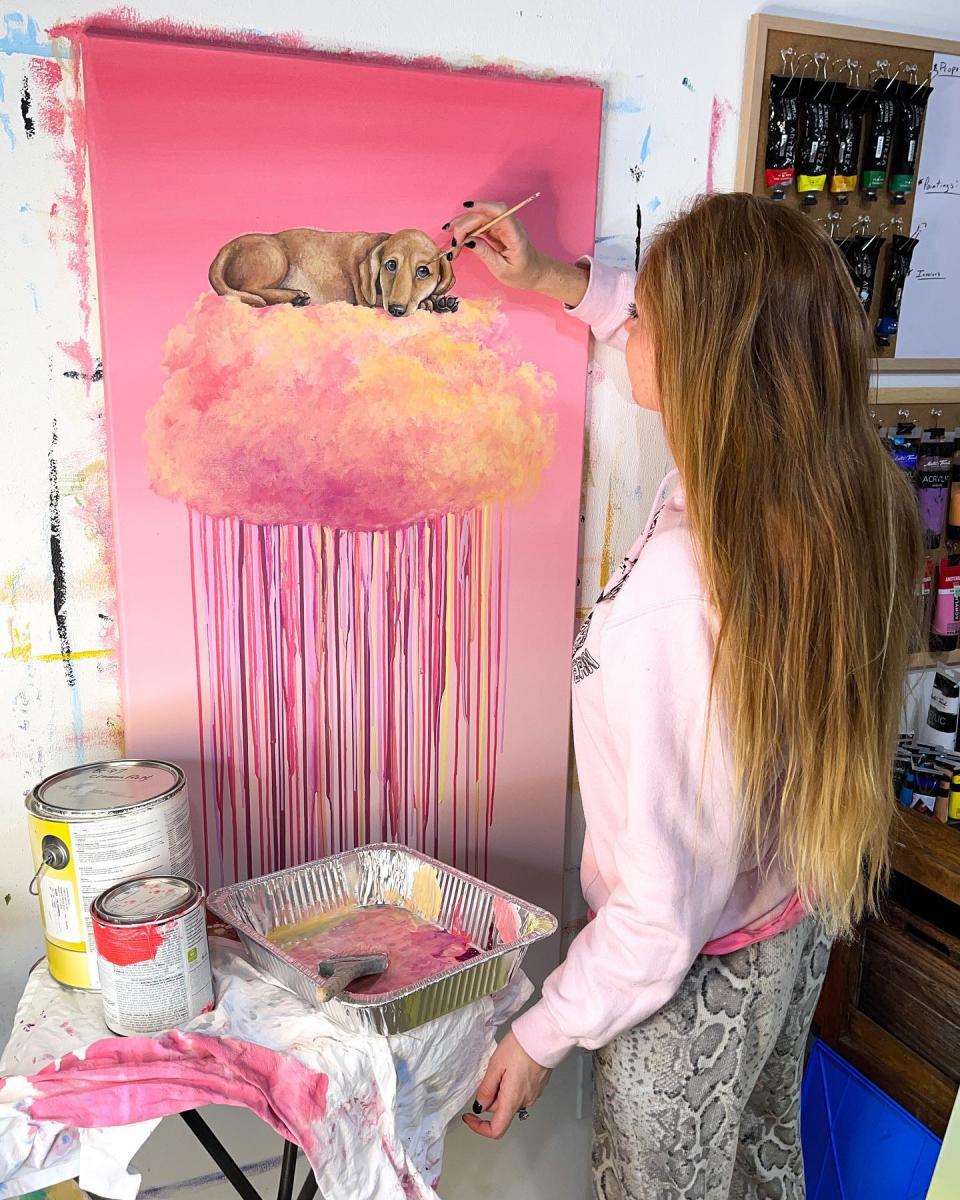 Andrea Ehrhardt Painting one of her famous cloud art