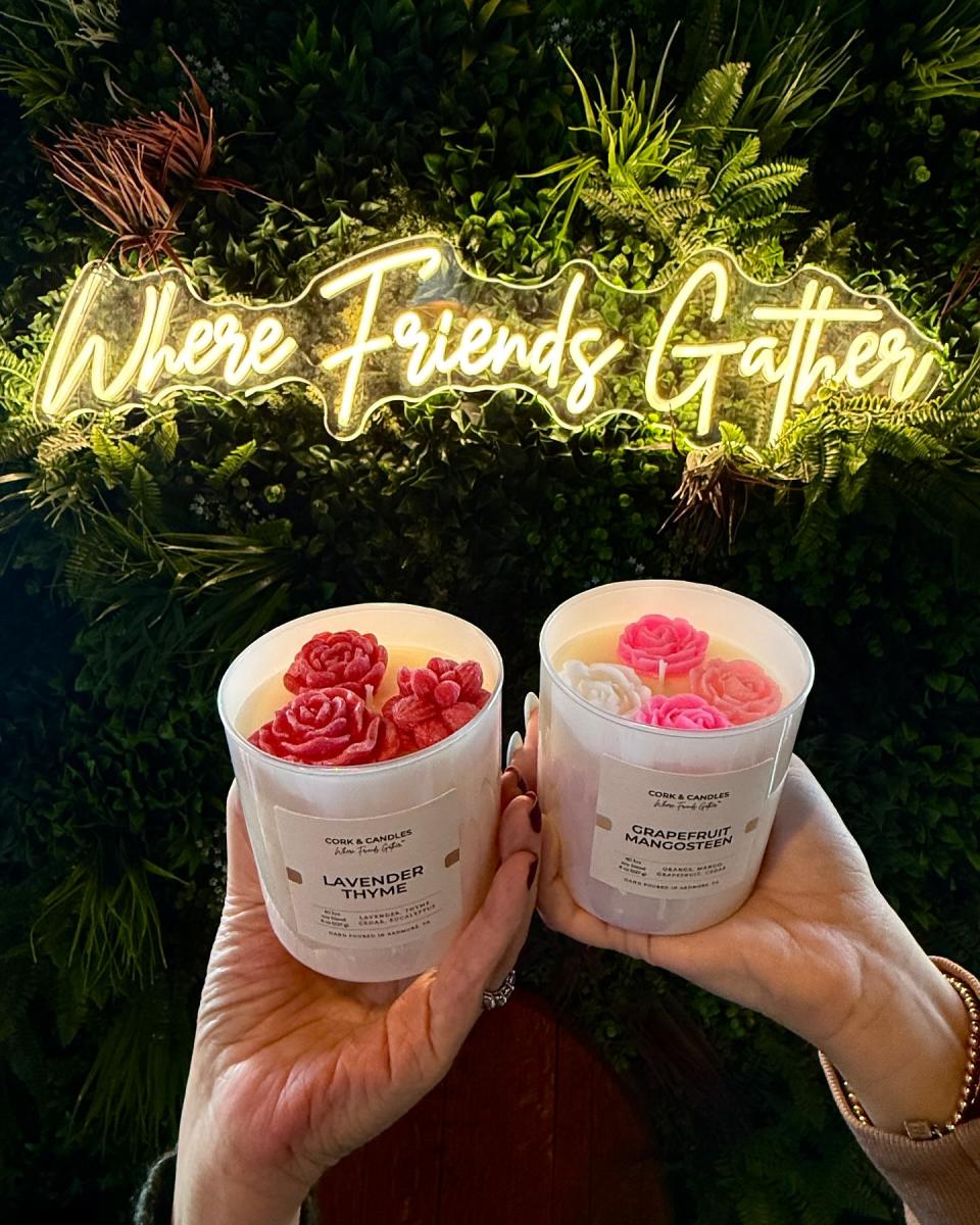 Hand holding candles at cork and candles in ardmore